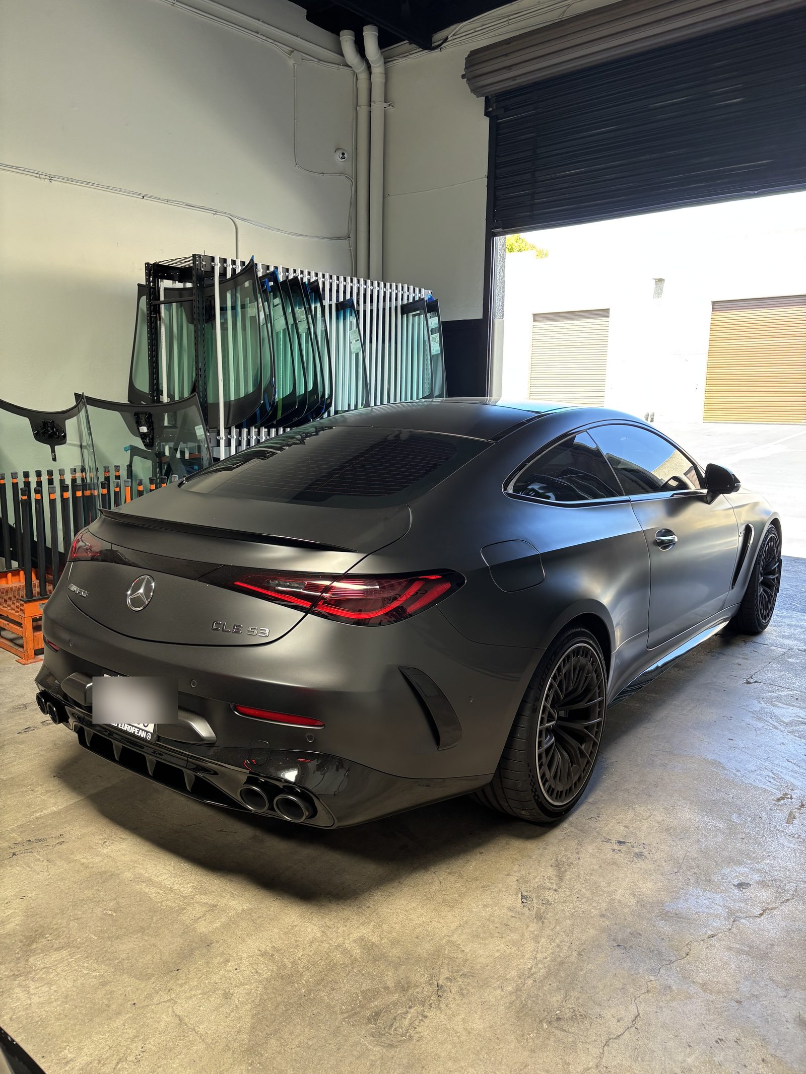 A Mercedes-AMG CLE 53 in the Connect Auto Glass shop